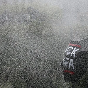 German police use water cannons against right-wing protestors during a demonstration in