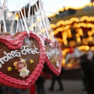 Gingerbread hearts reading Merry Christmas are on display at a booth at the opening Gingerbread hearts reading Merry Christmas are on display at a booth at the opening