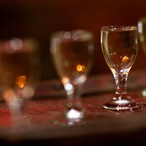 Glasses with Chinese spirit baijiu are seen on a bar top at the Capital Spirits Baijiu
