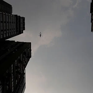 A helicopter flies above an anti-government rally in Wan Chai district, Hong Kong