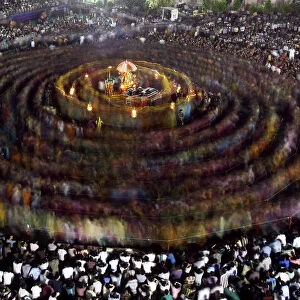 Hindu devotees perform Garba, a traditional folk dance, during the celebrations to