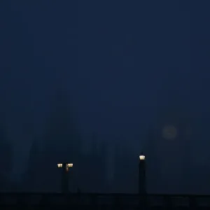 The Houses of Parliament are seen in late afternoon mist in central London