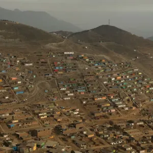 Huts and houses are seen on the hills of Nueva Esperanza ( New Hope