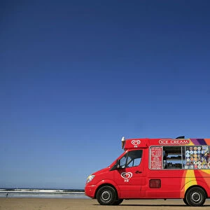 An ice cream vendor waits for business on Portstewart Strand beach