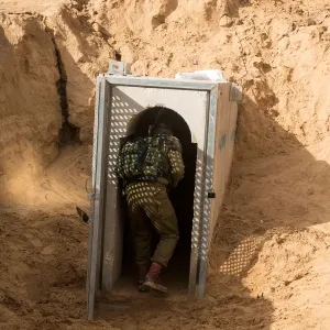 An Israeli soldier enters what the Israeli military say is a cross-border attack tunnel