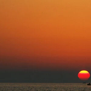 Jet ski rider enjoys the sunset at the Albanian beach of Durres