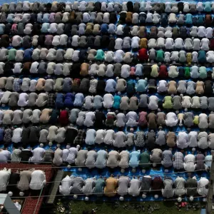 Kashmiris offer Eid-al-Adha prayers at a mosque during restrictions after the scrapping Kashmiris offer Eid-al-Adha prayers at a mosque during restrictions after the scrapping