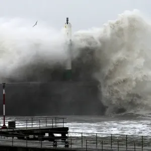 Large waves crash over the jetty at Aberystwyth in mid Wales