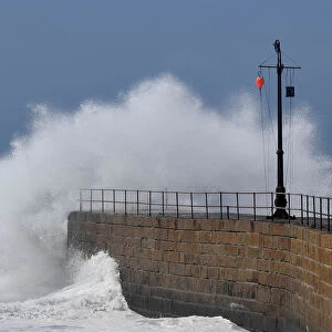 Large waves hit the harbour at Porthleven, Britain