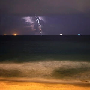 Lightning strikes over the Mediterranean sea during a rain storm near the city of