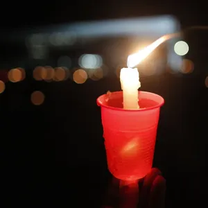 A lit candle is seen as Catholics keep vigil in front of Brazils Supreme Court, in A lit candle is seen as Catholics keep vigil in front of Brazils Supreme Court, in