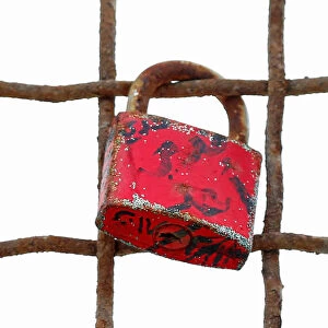 A love lock is seen attached to a metal fence near the canal of Port Said