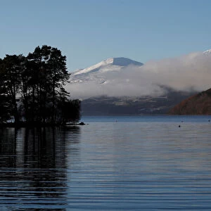 Low cloud drifts over Loch Tay in Perthshire