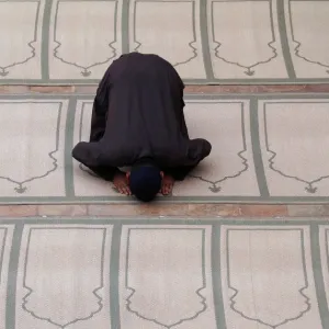 A man offers evening prayer at a mosque in Peshawar A man offers evening prayer at a mosque in Peshawar