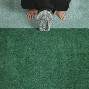 A man prays at the Baitul Futuh Mosque in London