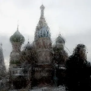A man is seen through an iced window walking past St