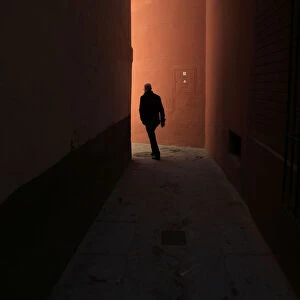 A man walks through the Santa Cruz neighbourhood in the Andalusian capital of Seville