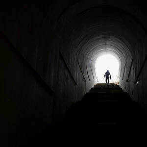 A man walks up steps towards Mausoleum of Njegos at Lovcen mountain near the town of