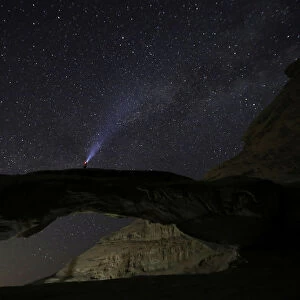 A man watches the stars seen on the sky of Al-Kharza area in Wadi Rum in the south of