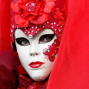 A masked reveller poses during the Venice Carnival in Venice