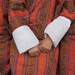 Men are seen wearing the gho, the tradional and national dress for men in Bhutan