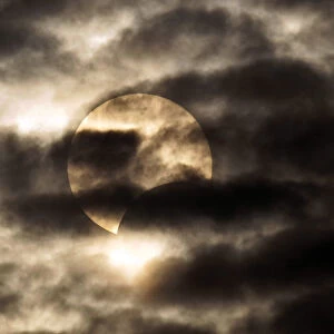 The moon passes between the sun and the earth during a solar eclipse in Shanghai