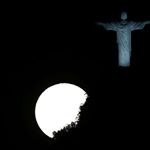 The full moon is pictured next to the Christ the Redeemer statue ahead of the 2016