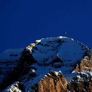 The moon rises over the Dolomites alps in Gardena pass in Val Gardena