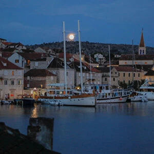 The moon rises over the town of Milna on the island of Brac