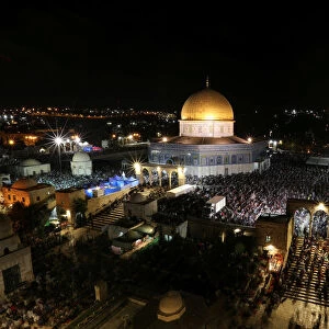 Muslim women pray in front of the Dome of the Rock, on the compound known to Muslims as