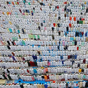 Muslims offer Eid al-Fitr prayers marking the end of the holy fasting month Ramadan in