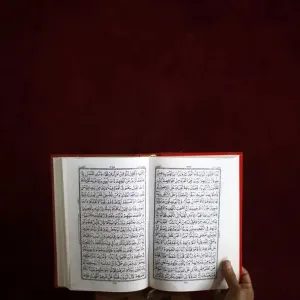 A Nepalese Muslim reads the Koran during the month-long fasting in the holy month of