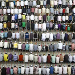 Nepali Muslims attend the mass prayer during the Eid al-Adha celebrations at the Kashmiri
