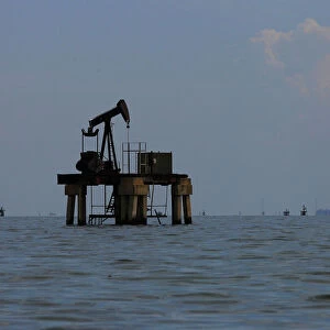 An oil pumpjack is seen at Lake Maracaibo in Lagunillas