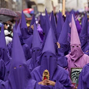 Penitents participate in a procession rally in Quito