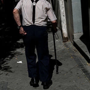 A pensioner goes for a walk in Madrid