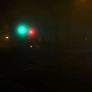 People cycle through heavy fog in Dublin