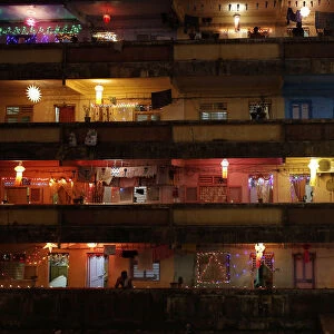 People decorate their houses with lanterns and lights as they celebrate Diwali in Mumbai
