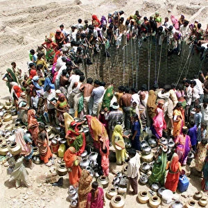 People Gather Around a Well