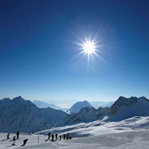 People skiing at Zugspitzplatt on top of the highest German mountain, the Zugspitze