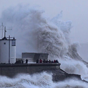 People view large waves and high winds associated with Storm Eleanor as they hit the