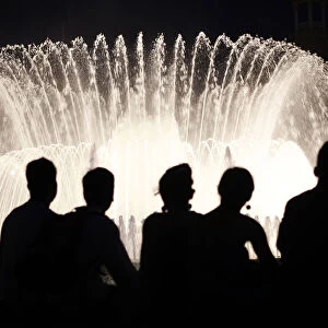 People watch the Font Magica de Montjuic (Magic Fountain of Montjuic) show in Barcelona