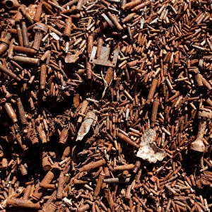 A pile of recyclable bullet casings used for the production of copper wires is seen at a