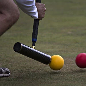 A player takes a stroke during the fifth annual Pacific Cup croquet tournament in