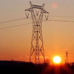 Pylons of high-tension electricity power lines are seen during sunset in Bordeaux