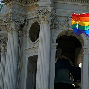 A rainbow flag flies over the Brooklyn Borough Hall in the Brooklyn borough of New York