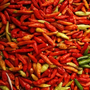 Red and green chillies are seen at a traditional market in Jakarta