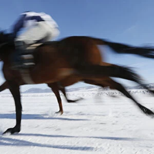 Riders compete on frozen Yenisei River during 47th Ice Derby amateur horse race near