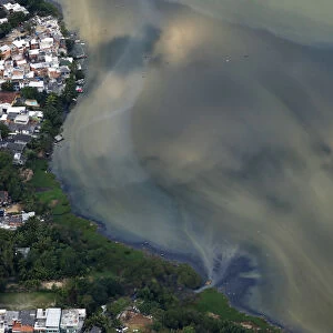 A river ends in Rio bay in Rio de Janeiro