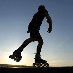 A rollerblader wears shorts during a spring-like day at Vancouvers English Bay during